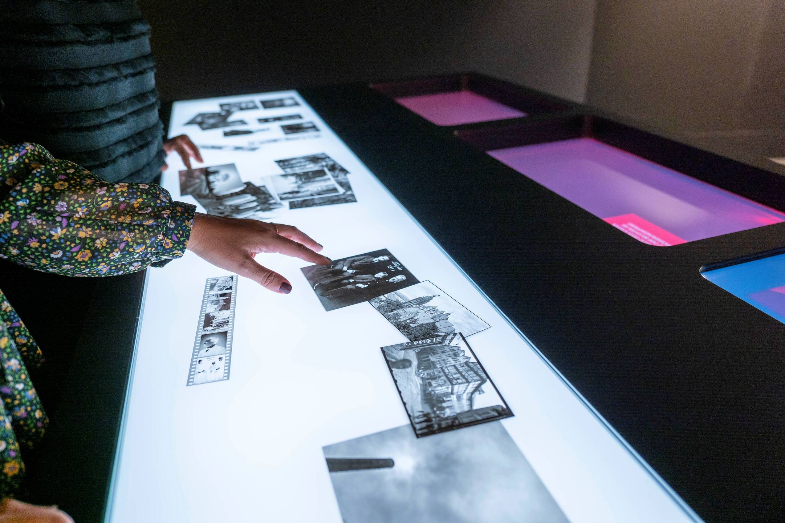 Visitors can digitally recreate the steps of analog photo development at a large interactive table in the darkroom at the Ernst Leitz Museum.