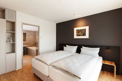 Two single beds in the light Executive Double Room.