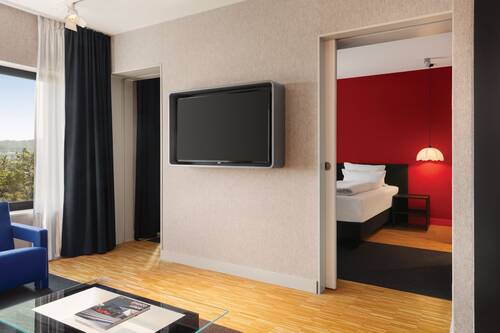 Living area in the Studio Deluxe with a view towards the bedroom.